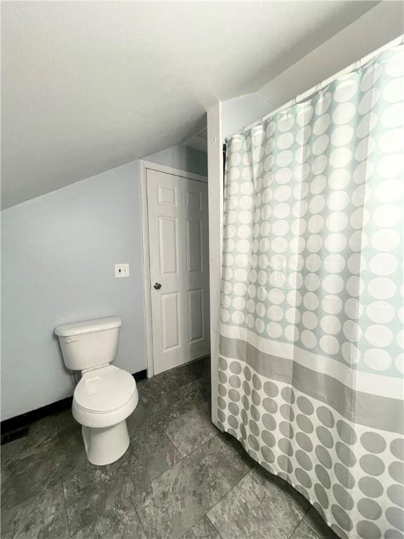1842 E Lake Rd, Spafford, NY 13152 - full bath featuring toilet, baseboards, a shower with shower curtain, and vaulted ceiling