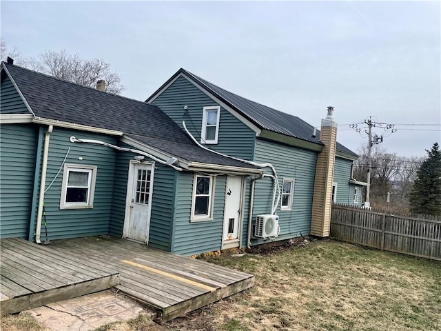 1842 E Lake Rd, Spafford, NY 13152 - back of house with a yard, fence, a shingled roof, and a wooden deck