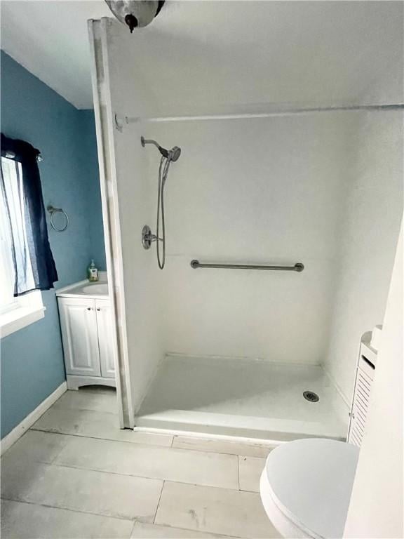1842 E Lake Rd, Spafford, NY 13152 - bathroom featuring a shower stall, vanity, and toilet