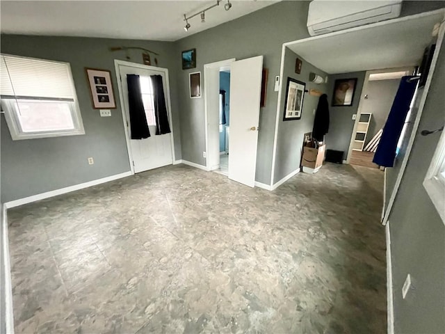 1842 E Lake Rd, Spafford, NY 13152 - interior space with track lighting, a wall mounted AC, and baseboards