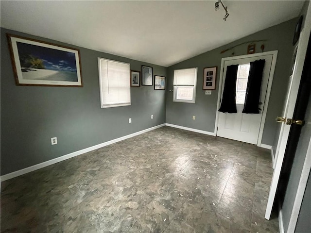 1842 E Lake Rd, Spafford, NY 13152 - unfurnished bedroom with baseboards and vaulted ceiling