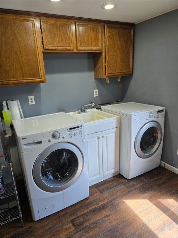 1842 E Lake Rd, Spafford, NY 13152 - washroom with baseboards, a sink, dark wood finished floors, cabinet space, and washing machine and dryer