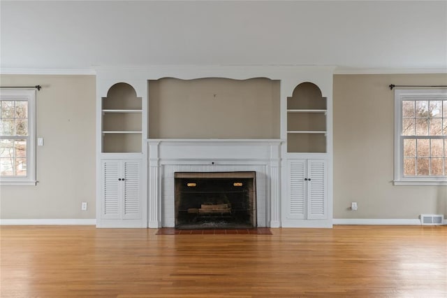 507 Hilltop Rd, Union, NY 13760 - unfurnished living room with ornamental molding, built in features, baseboards, and visible vents