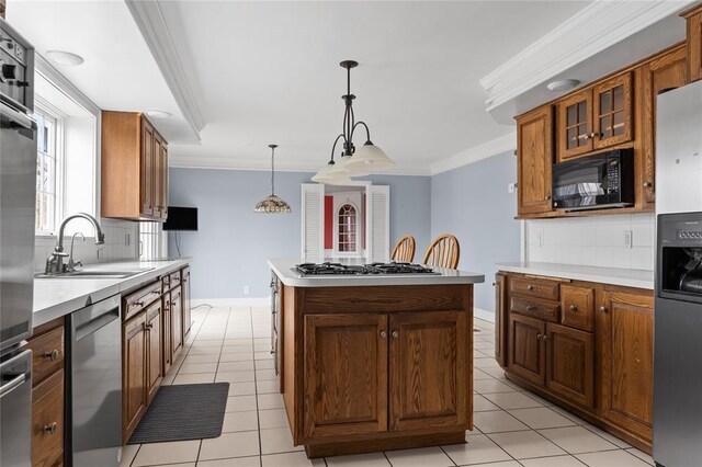 507 Hilltop Rd, Union, NY 13760 - kitchen with backsplash, a center island, crown molding, and appliances with stainless steel finishes