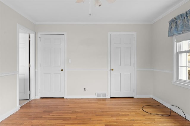 507 Hilltop Rd, Union, NY 13760 - unfurnished bedroom with visible vents, crown molding, and light wood-style floors