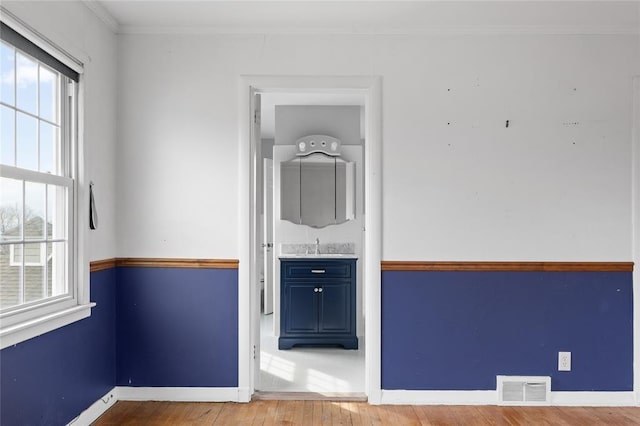 507 Hilltop Rd, Union, NY 13760 - empty room featuring baseboards, visible vents, a healthy amount of sunlight, and wood finished floors