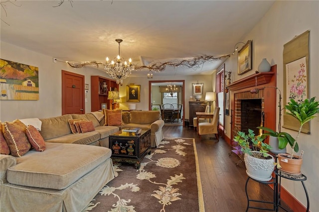4508 State Route 64, Bristol, NY 14424 - living area with a fireplace, dark wood-style floors, baseboards, and an inviting chandelier