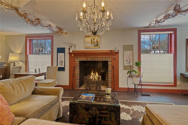 4508 State Route 64, Bristol, NY 14424 - living area with wood finished floors, a healthy amount of sunlight, and a brick fireplace