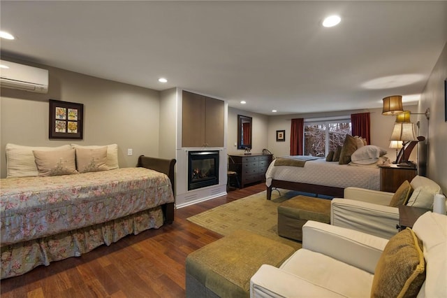 4508 State Route 64, Bristol, NY 14424 - bedroom featuring a wall mounted AC, dark wood-style floors, a glass covered fireplace, and recessed lighting