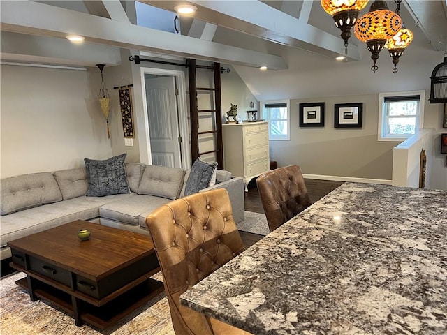 4508 State Route 64, Bristol, NY 14424 - living room with dark wood finished floors, lofted ceiling with beams, baseboards, and a wealth of natural light