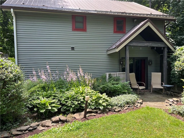 4508 State Route 64, Bristol, NY 14424 - rear view of property featuring metal roof and a patio area
