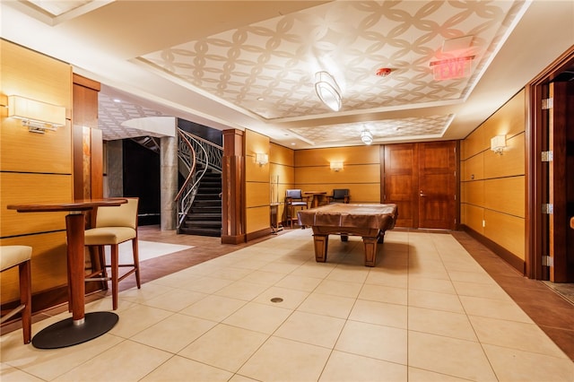 237 Bretlyn Cir, Brighton, NY 14618 - game room with a tray ceiling, billiards, wooden walls, and light tile patterned floors