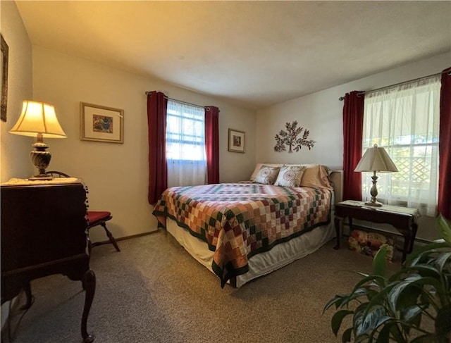 carpeted bedroom with baseboards