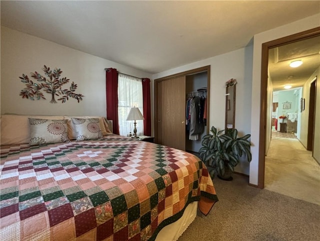 carpeted bedroom featuring a closet