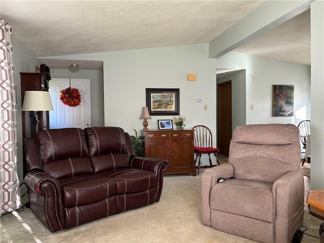 living area featuring vaulted ceiling with beams and light colored carpet