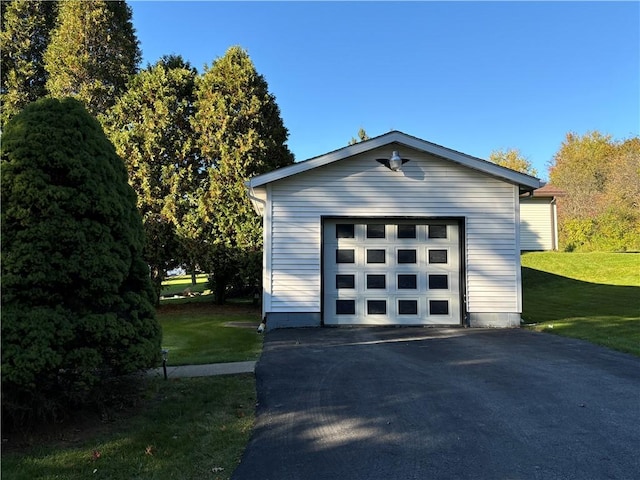 detached garage with aphalt driveway