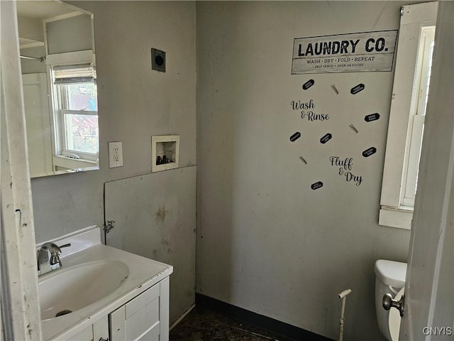 bathroom featuring toilet and vanity