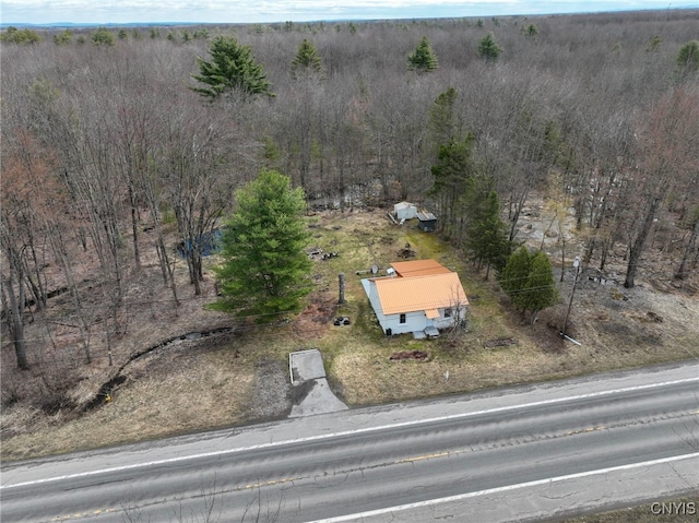 7436 Nys Route 13 E, Vienna, NY 13308 - aerial view of property and surrounding area featuring a heavily wooded area