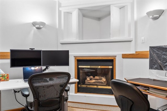 office with a glass covered fireplace