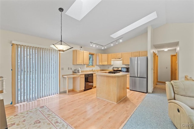 kitchen with open floor plan, dishwasher, a skylight, freestanding refrigerator, and light brown cabinets