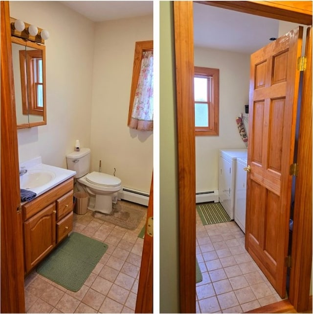 bathroom featuring toilet, vanity, washer and dryer, and baseboard heating