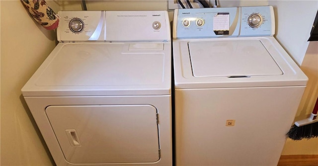 washroom featuring washer and clothes dryer
