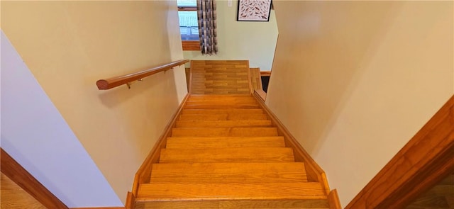stairs featuring baseboards