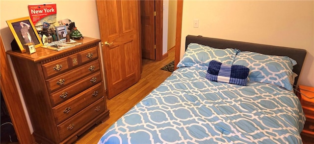 bedroom featuring wood finished floors