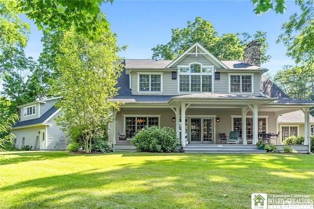 2401/2 Lakeside Dr, Ellery, NY 14712 - back of property featuring a chimney and a lawn