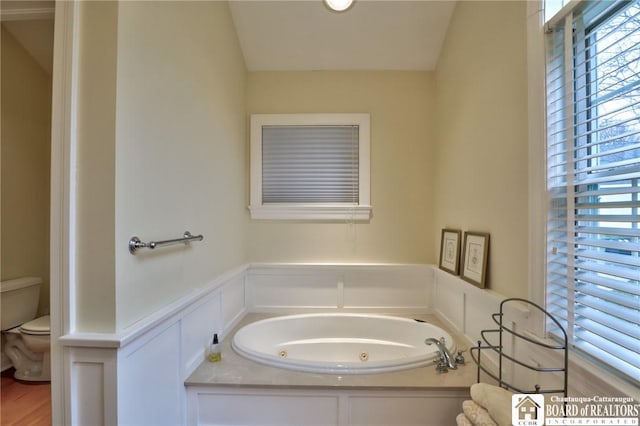 2401/2 Lakeside Dr, Ellery, NY 14712 - bathroom with toilet, a decorative wall, a wainscoted wall, and a jetted tub