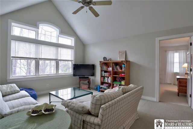 2401/2 Lakeside Dr, Ellery, NY 14712 - carpeted living room with high vaulted ceiling, baseboards, and ceiling fan