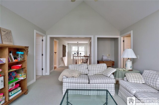 2401/2 Lakeside Dr, Ellery, NY 14712 - living room featuring high vaulted ceiling, a notable chandelier, baseboards, and carpet floors