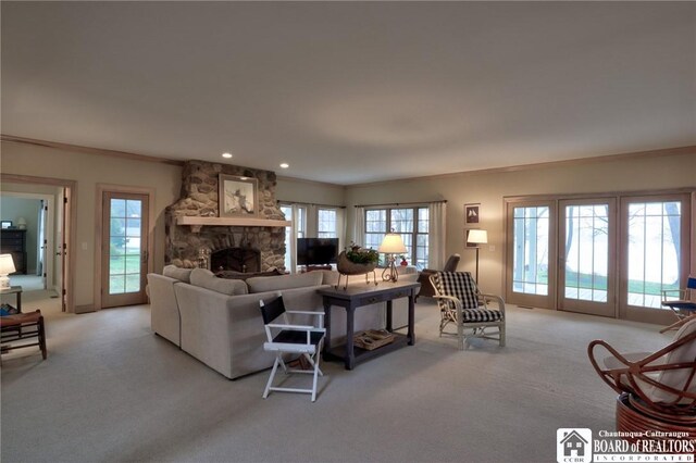 2401/2 Lakeside Dr, Ellery, NY 14712 - living area featuring crown molding, a stone fireplace, and carpet flooring