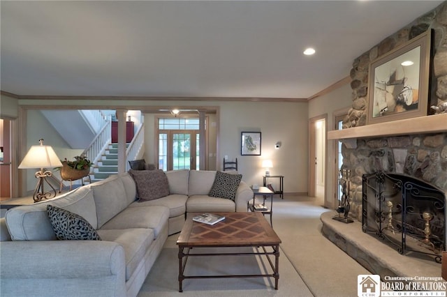 2401/2 Lakeside Dr, Ellery, NY 14712 - living room with crown molding, light colored carpet, a stone fireplace, stairway, and baseboards