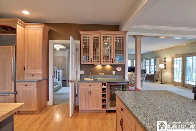 2401/2 Lakeside Dr, Ellery, NY 14712 - kitchen with glass insert cabinets, built in refrigerator, light wood-type flooring, wine cooler, and ornate columns