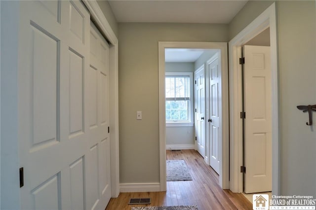 2401/2 Lakeside Dr, Ellery, NY 14712 - corridor featuring light wood-style floors, baseboards, and visible vents