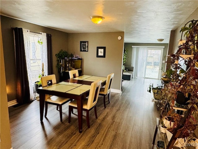 673 Cooper St, Watertown-City, NY 13601 - dining space with baseboards and wood finished floors