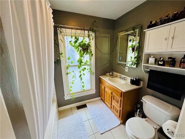 673 Cooper St, Watertown-City, NY 13601 - bathroom with toilet, vanity, tile patterned flooring, and a wealth of natural light