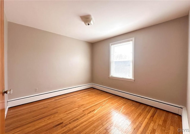 spare room featuring hardwood / wood-style flooring