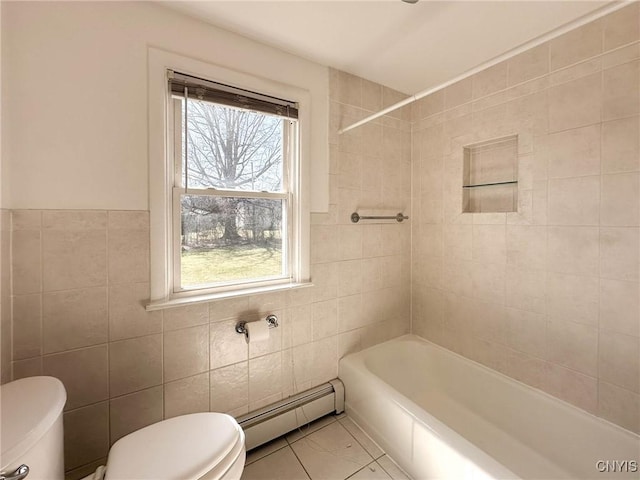 full bathroom featuring a baseboard radiator, toilet, tub / shower combination, and tile walls