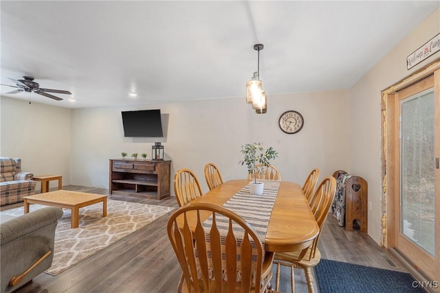 dining room with ceiling fan and wood finished floors