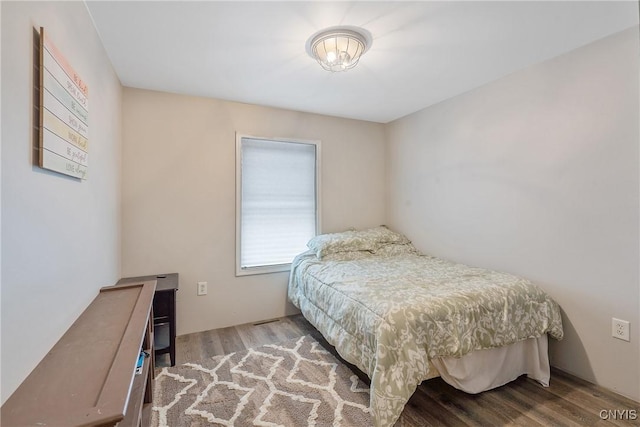 bedroom with wood finished floors