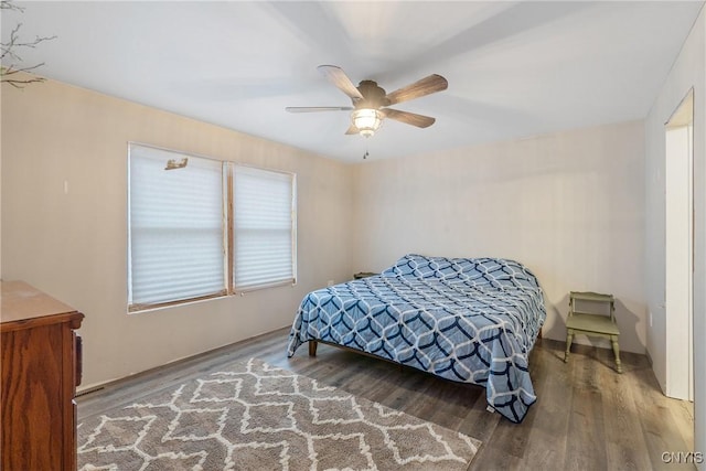 bedroom with wood finished floors and a ceiling fan