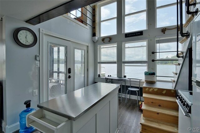 46337 Lake Of The Isle, Alexandria, NY 13607 - kitchen featuring white electric stove, wood finished floors, white cabinetry, french doors, and a center island
