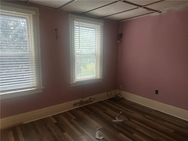 344 Tremont St, Rochester, NY 14608 - spare room with dark wood-style floors and baseboards