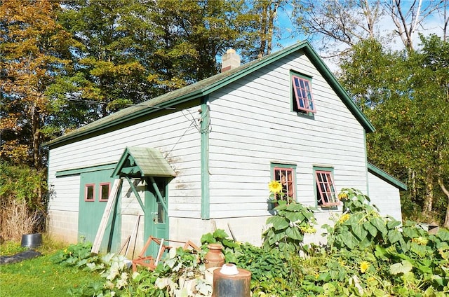265 Main St, Delhi, NY 13753 - view of side of home featuring a chimney