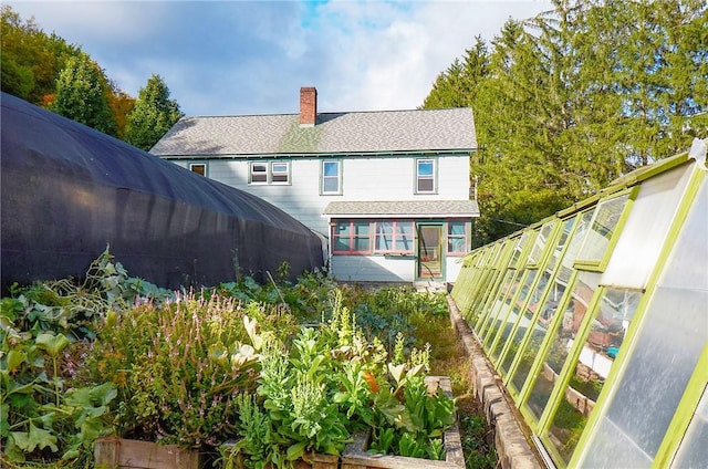 265 Main St, Delhi, NY 13753 - back of property featuring a chimney, fence, and roof with shingles