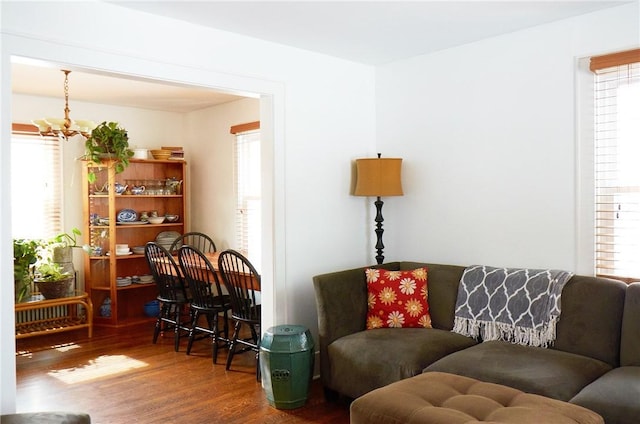 265 Main St, Delhi, NY 13753 - living room with wood finished floors, an inviting chandelier, and plenty of natural light