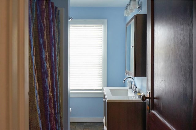 265 Main St, Delhi, NY 13753 - bathroom featuring baseboards, toilet, and vanity