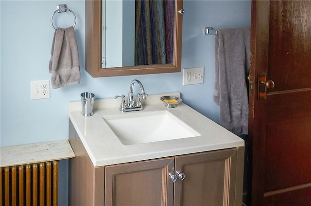 265 Main St, Delhi, NY 13753 - bathroom featuring radiator heating unit and vanity